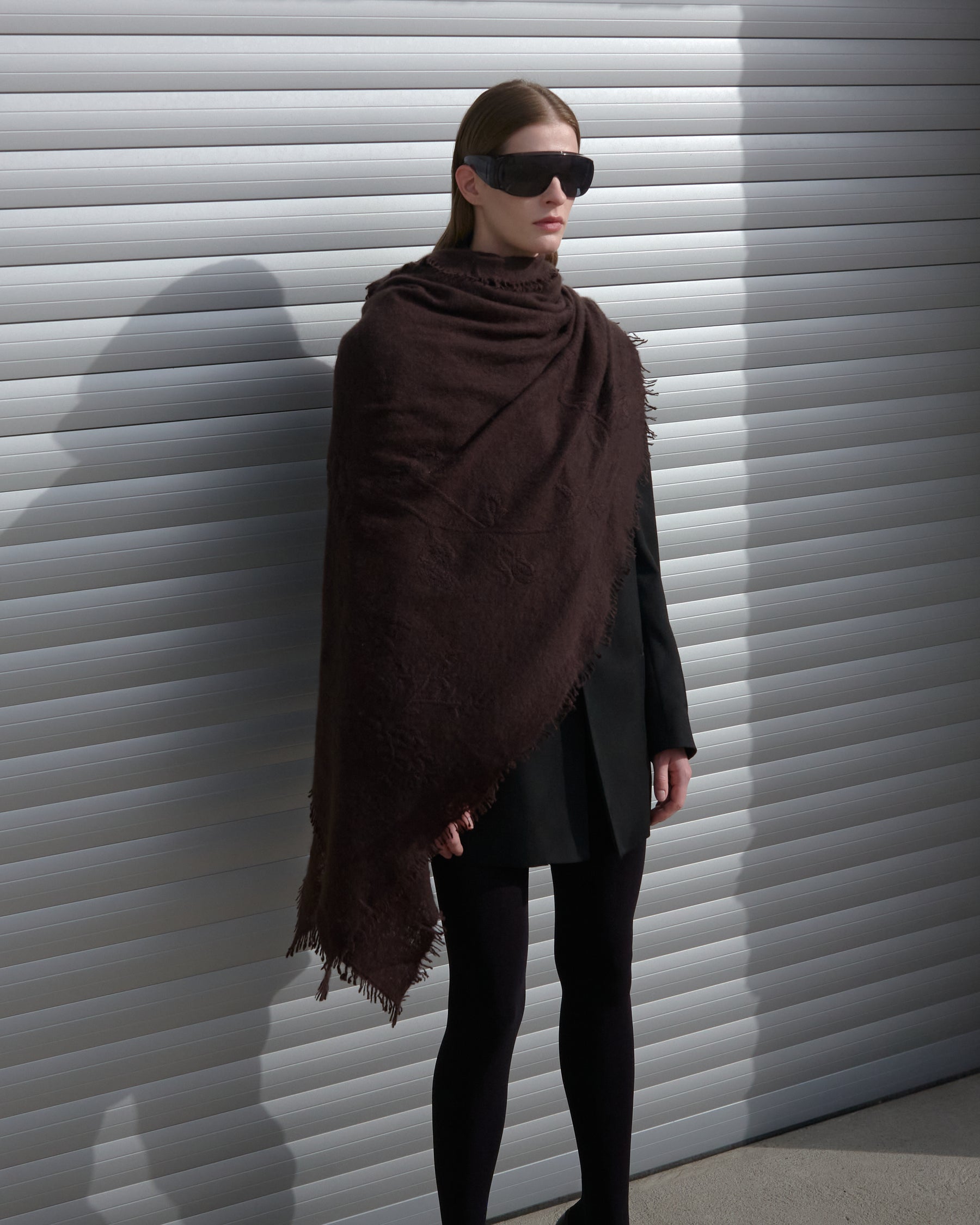 Woman wearing Ella Silla Scarf color brown, 100 percent cashmere felted with embroidery